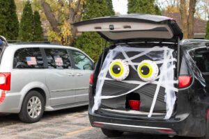 Car trunk decorated as a mummy for trunk-or-treat